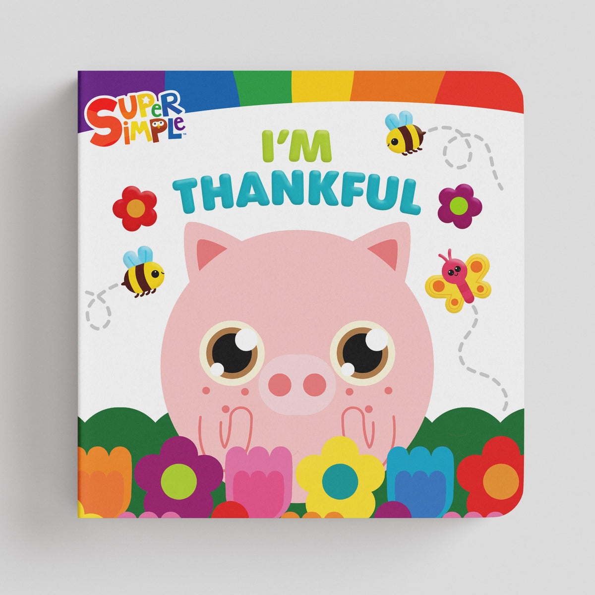 A children's board book titled 'I'm Thankful' by Super Simple, featuring a cute pink pig character surrounded by colorful flowers and bees on a light gray background.
